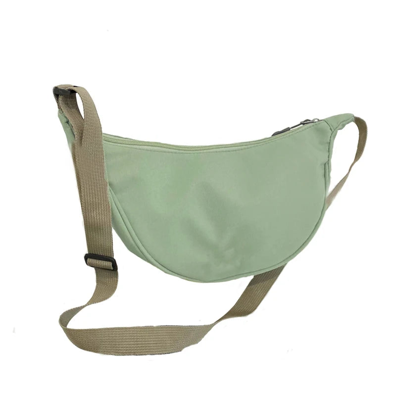 Women's bag - A round-shaped nylon bag with a cross-body strap, suitable for traveling, going to school or shopping.