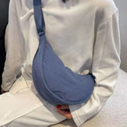 Women's bag - A round-shaped nylon bag with a cross-body strap, suitable for traveling, going to school or shopping.